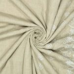 Vævet polyester/bomuld med broderi i beige