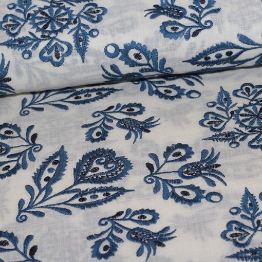 Vævet bomuld med blåt broderi