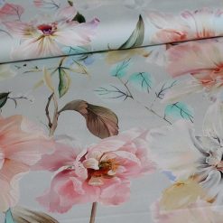 Bomuldssatin med sart pastel blomsterprint