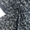 Gabardine i sort med broderi
