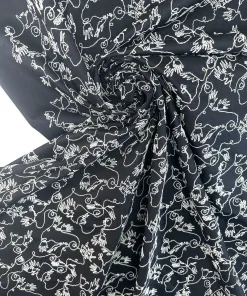 Gabardine i sort med broderi
