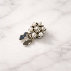 Knapdækslel med blomst