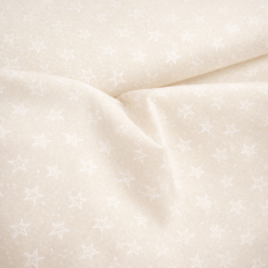 Flødefarvet bomuld med små stjerner