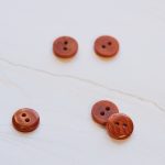 2-hole corozo button fv. Pumpkin - 11 mm
