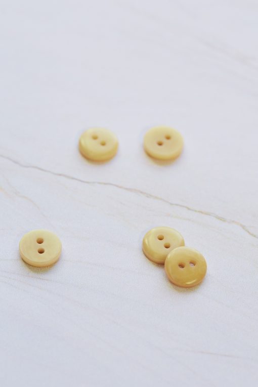 2-hole corozo button fv. Blonde yellow - 11 mm